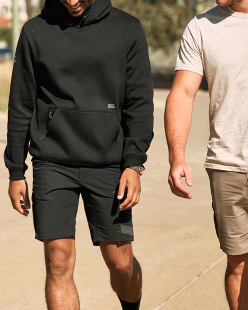 Black Coloured Hard Yakka Raptor Active Cargo Shorts on Blurry Background