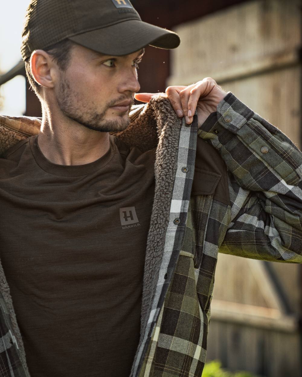 Willow Green Phantom Coloured Harkila Asmund Insulated Wool Shirt Jacket On A Backyard Background