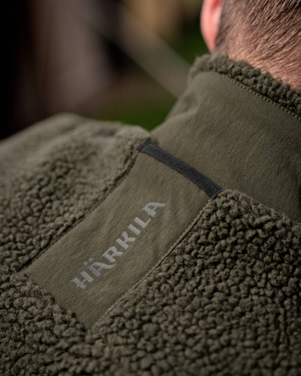 Rosin Coloured Harkila Fjell Polar Waistcoat on outdoor background