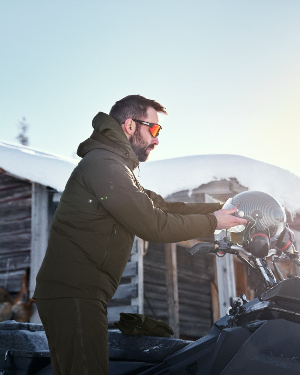 Willow Green Coloured Harkila Logmar HWS Packable Jacket on snow background