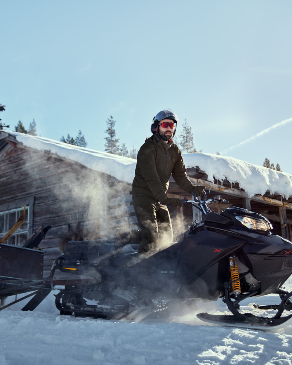 Willow Green Coloured Harkila Logmar HWS Packable Jacket on snow background