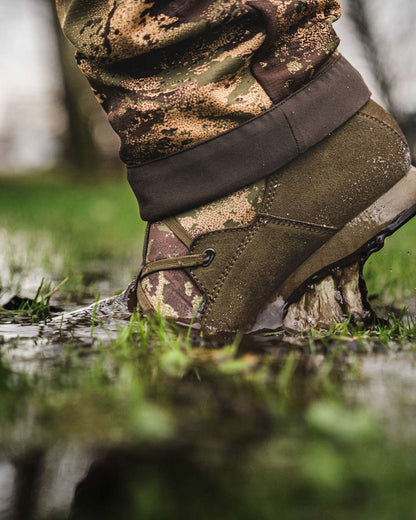AXIS Forest coloured Harkila Stalking Sneaker GTX Boots on Field background