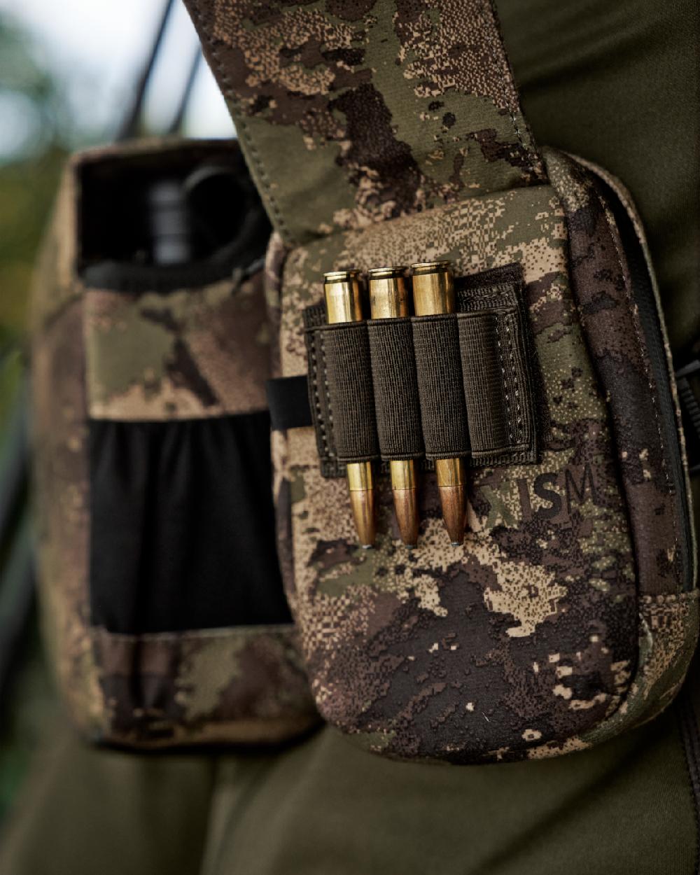 AXIS MSPForest Coloured Harkila Utility Camo Pouch on blurry background