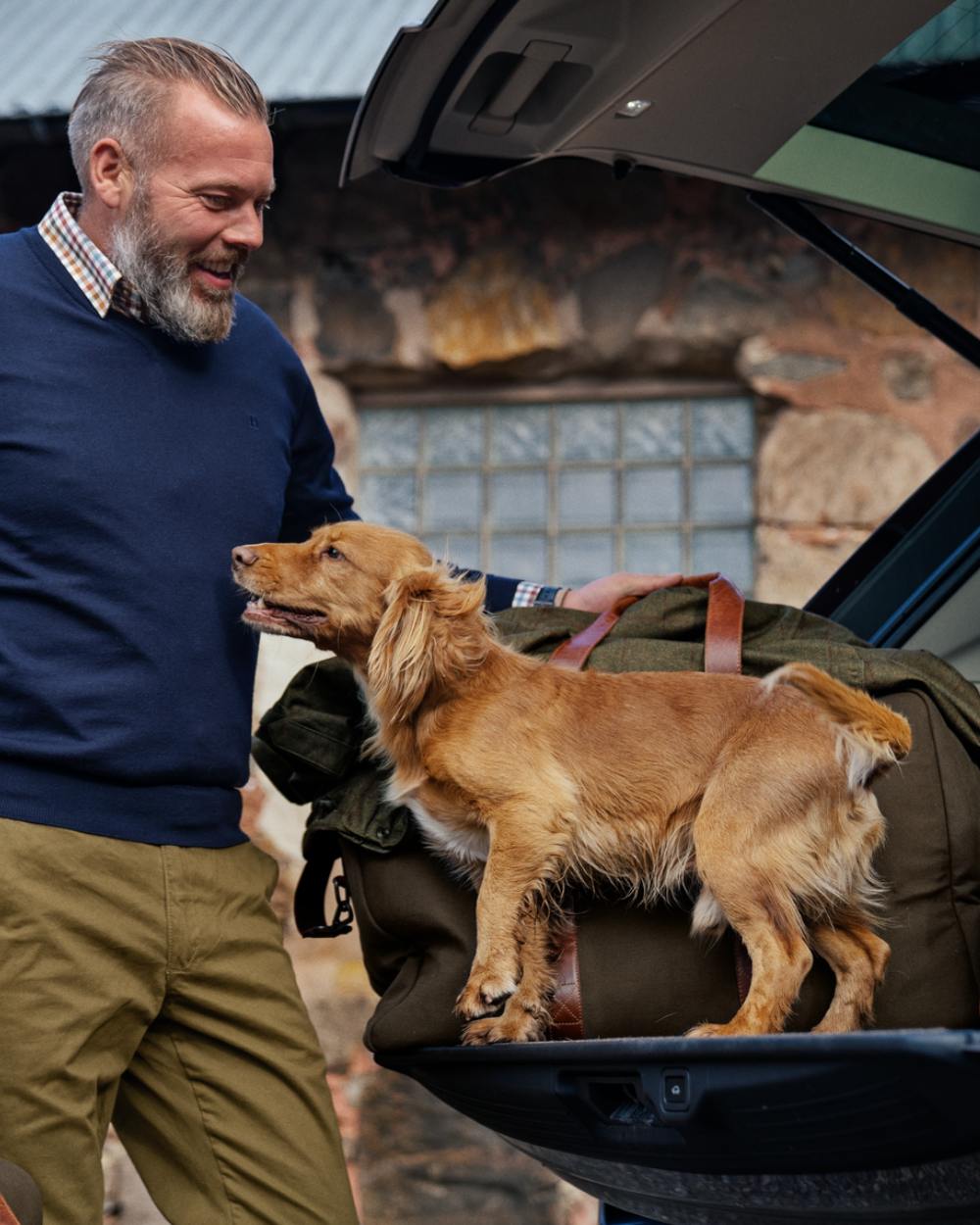 Warm Olive Coloured Harkila Weekend Bag 30L on outdoor background