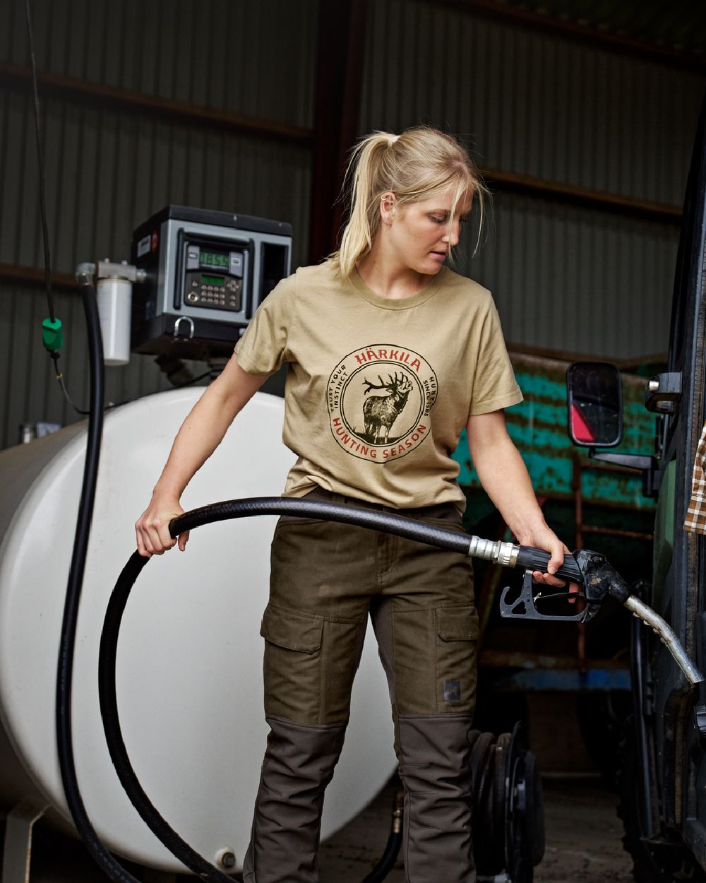 Sand Coloured Harkila Womens Stag Badge Short Sleeve T-Shirt on gas-station background