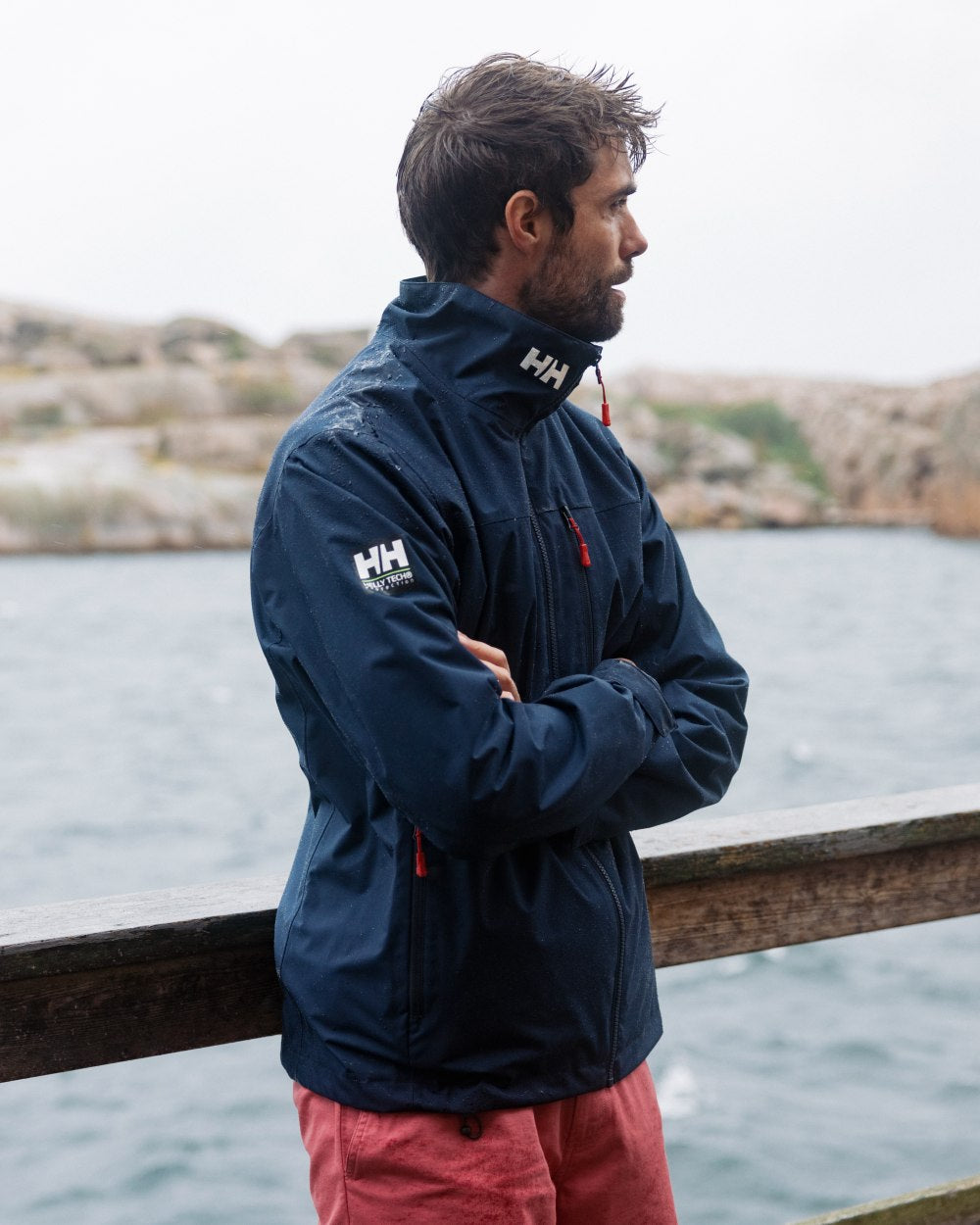 Washed Red Coloured Helly Hansen Mens Dock Shorts on Beach Background