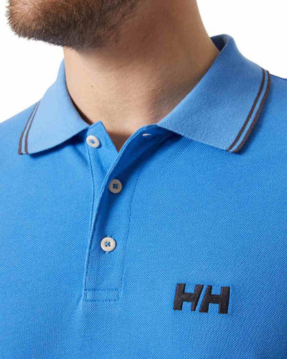 Ultra Blue coloured Helly Hansen Mens Genova Polo T-Shirt on white background 