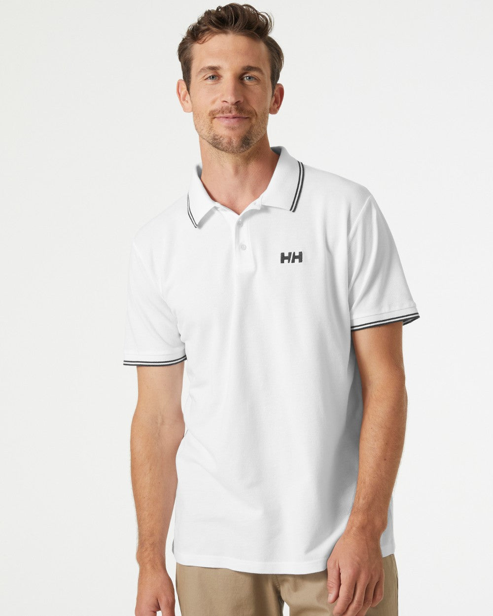 White coloured Helly Hansen Mens Genova Polo T-Shirt on grey background 