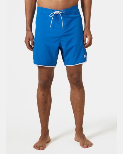 Cobalt 2.0 coloured Helly Hansen Mens HP 7 inch Curve Board Shorts on grey background 