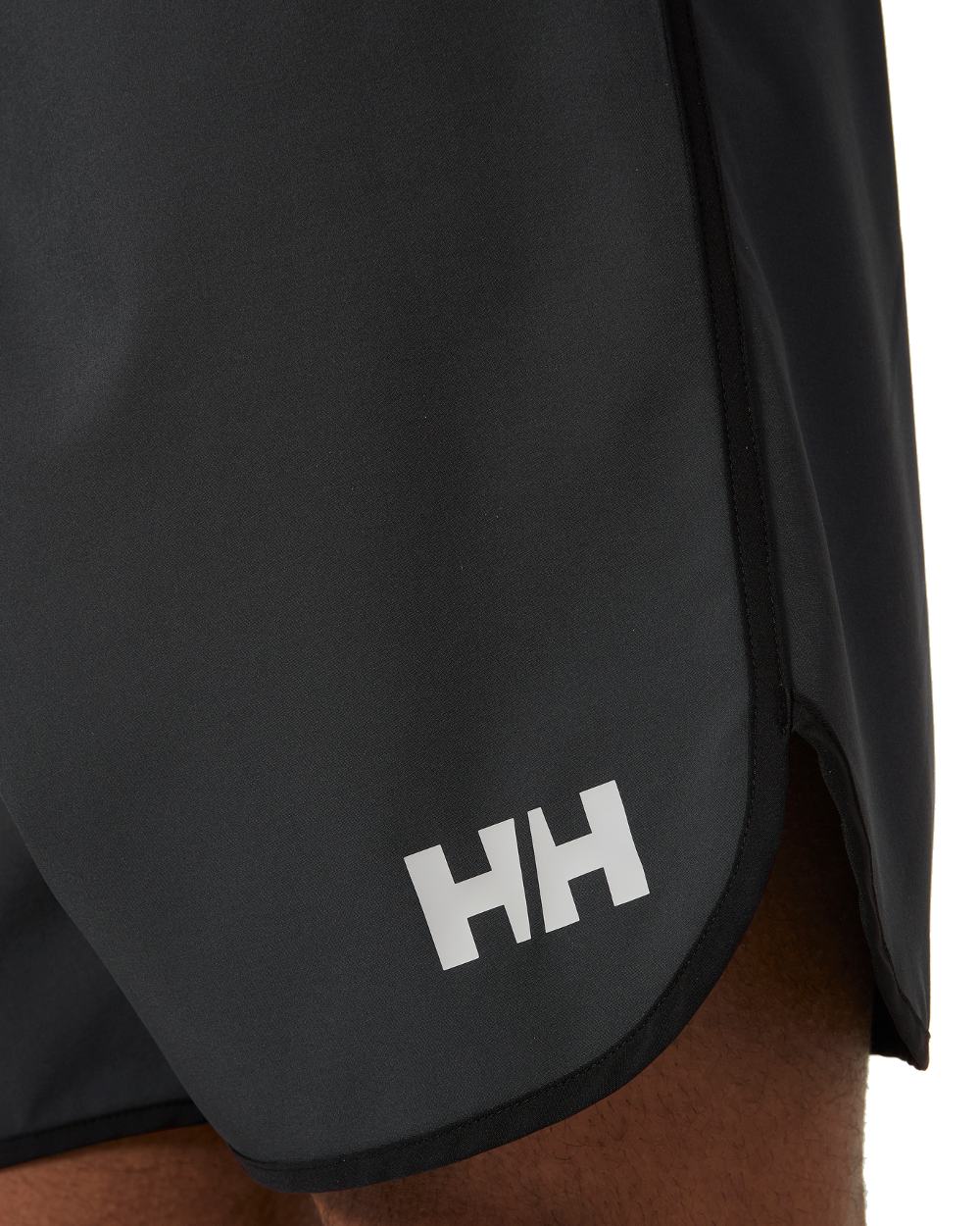 Ebony coloured Helly Hansen Mens HP 7 inch Curve Board Shorts on white background 