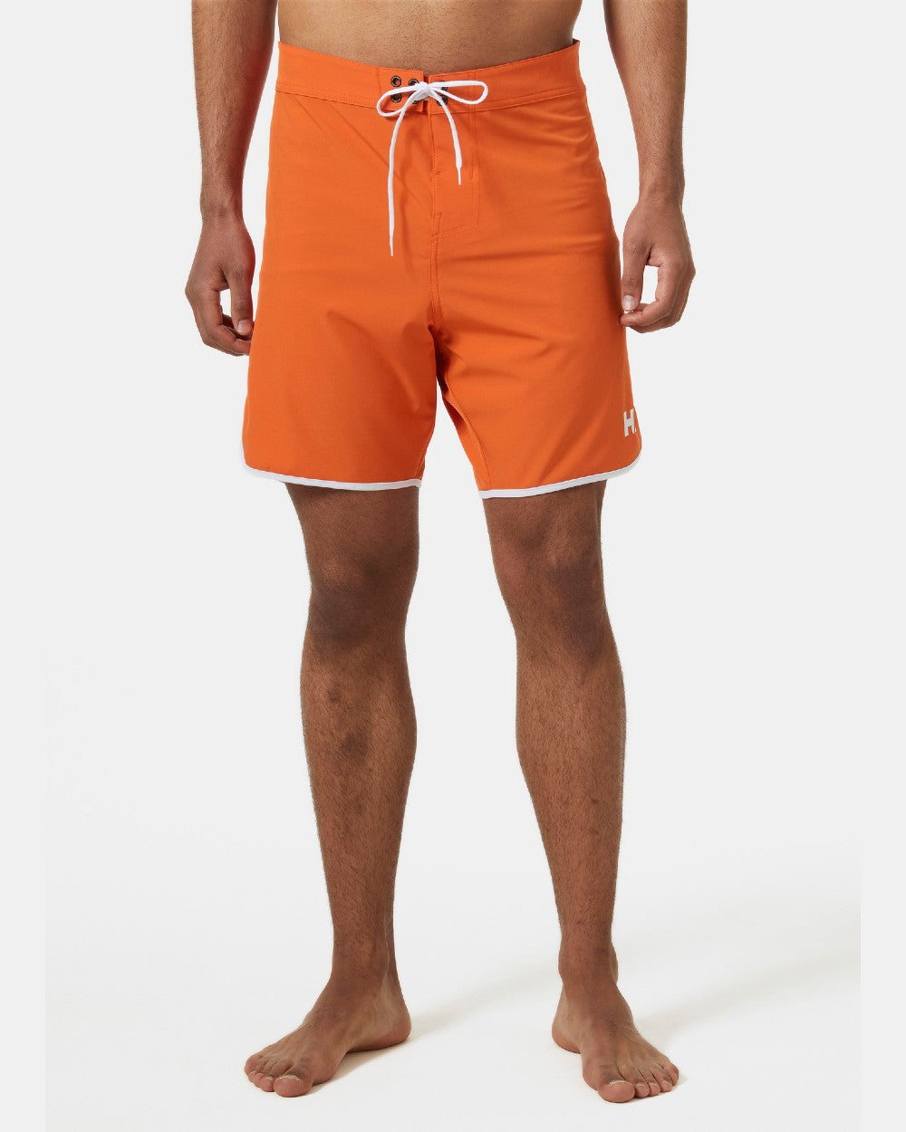 Flame coloured Helly Hansen Mens HP 7 inch Curve Board Shorts on grey background 