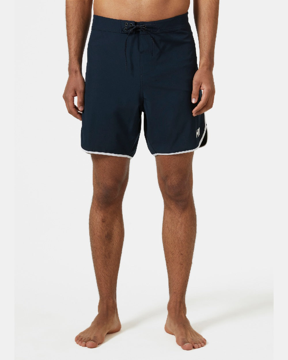 Navy coloured Helly Hansen Mens HP 7 inch Curve Board Shorts on grey background 