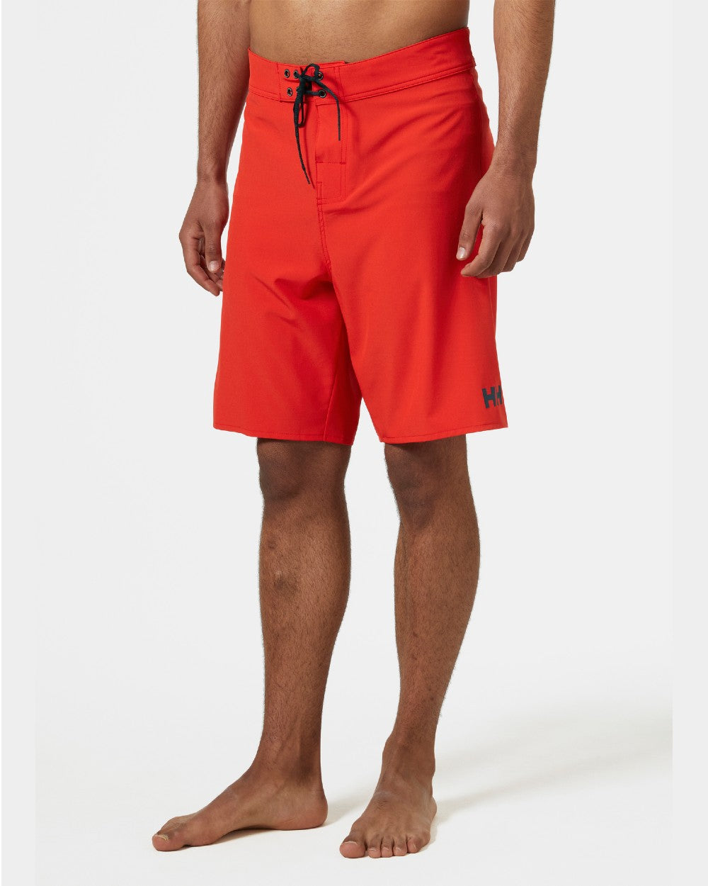 Alert Red Coloured Helly Hansen Mens HP 9 inch Board Shorts 3.0 on grey background