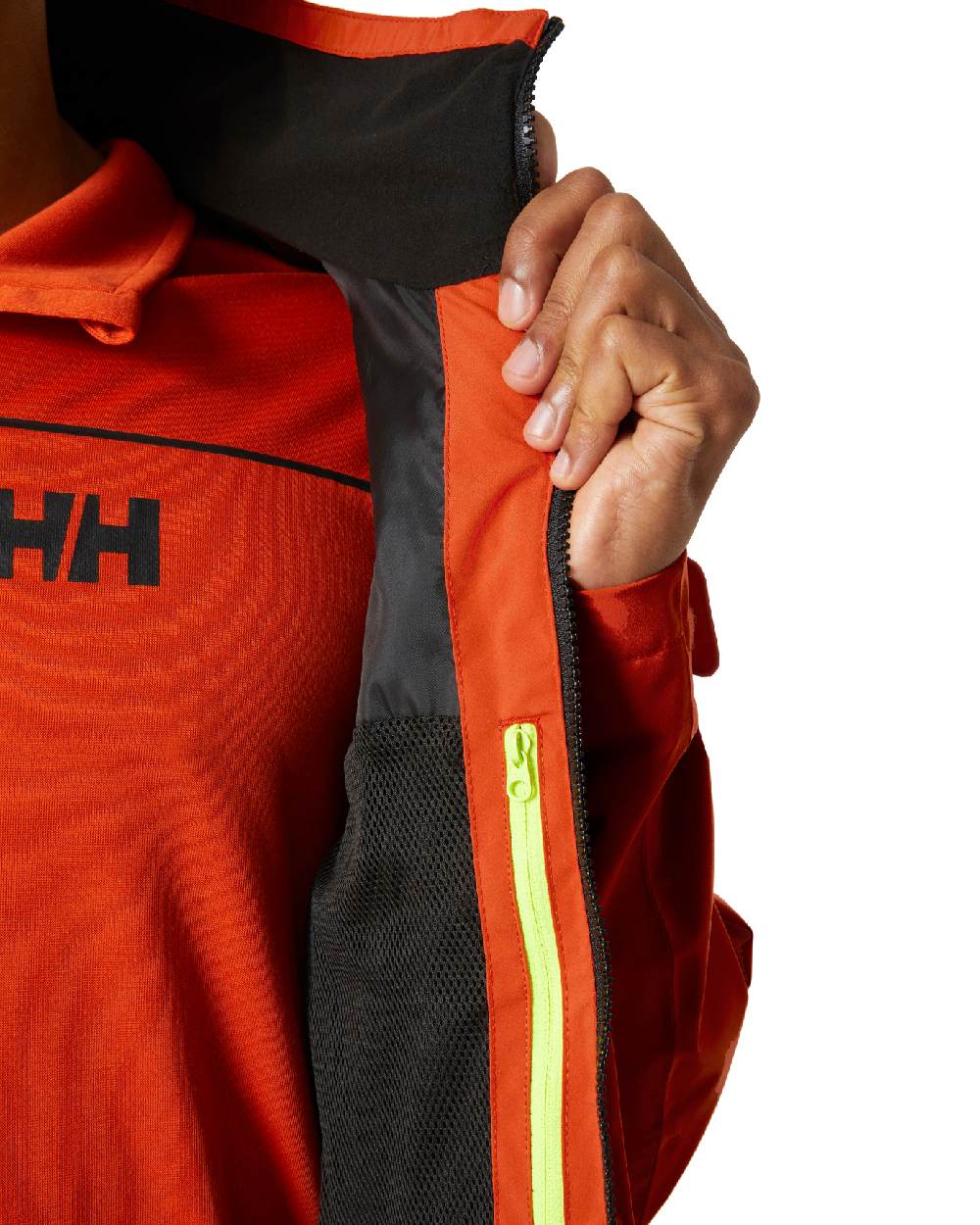Patrol Orange coloured Helly Hansen Mens HP Racing Sailing Jacket on white background