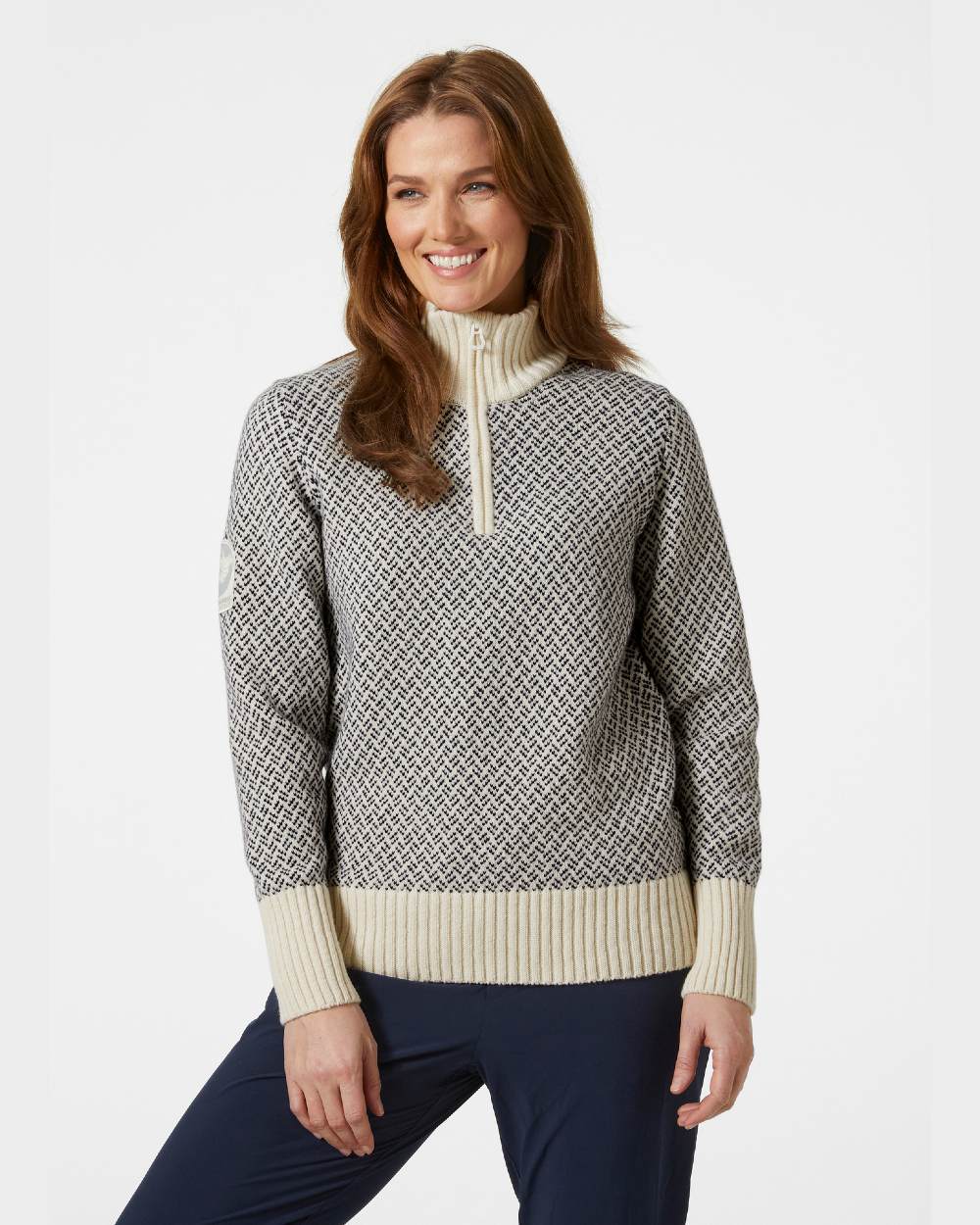 Snow coloured Helly Hansen Womens Arctic Iceland Knit Sweater on grey background 