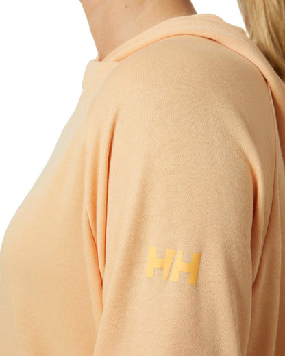 Miami Peach coloured Helly Hansen Womens Inshore Quick Dry Hoodie on white background 