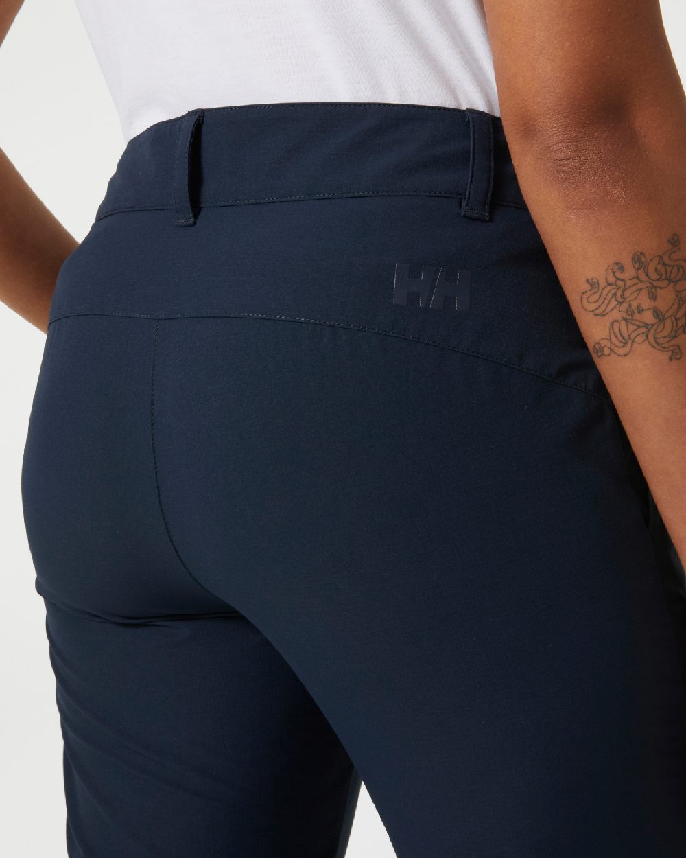 Navy coloured Helly Hansen Womens Quick Dry Pants on grey background