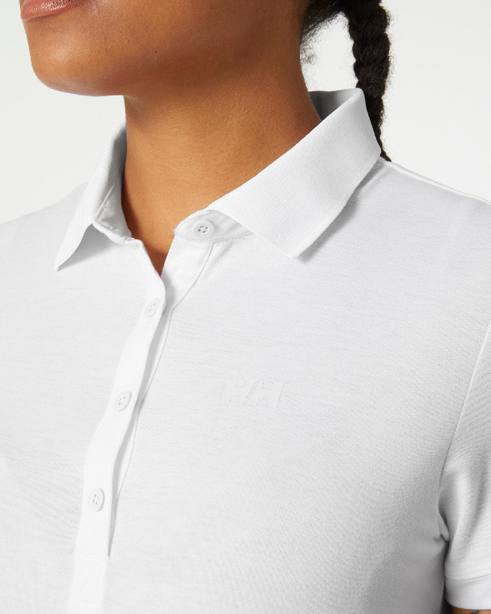 White coloured Helly Hansen Womens Siren Quick Dry Polo T-shirt on grey background