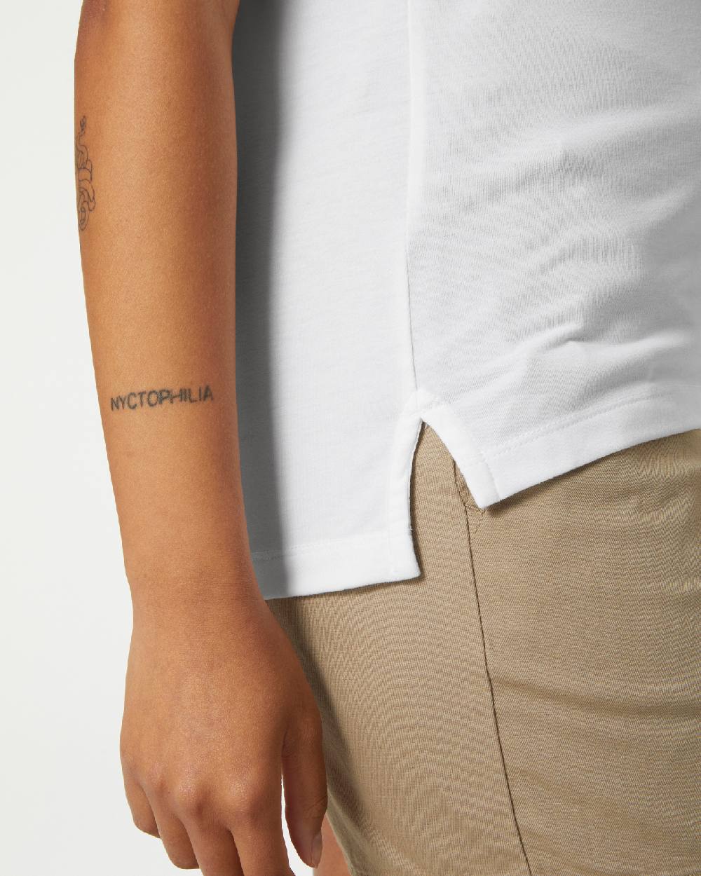 White coloured Helly Hansen Womens Siren Quick Dry Polo T-shirt on grey background