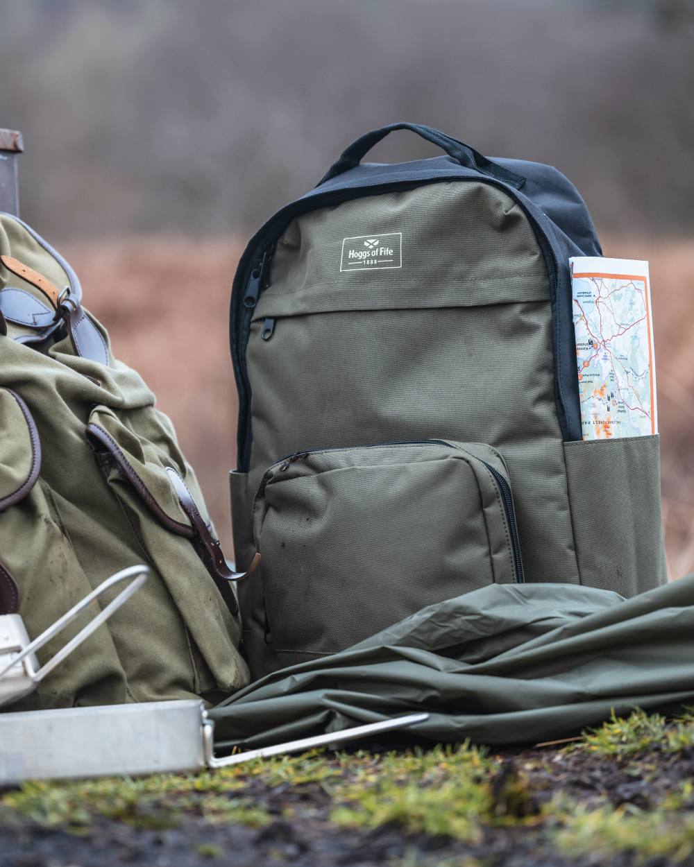 Green Black Coloured Hoggs of Fife Field & Trek Backpack on blurry background