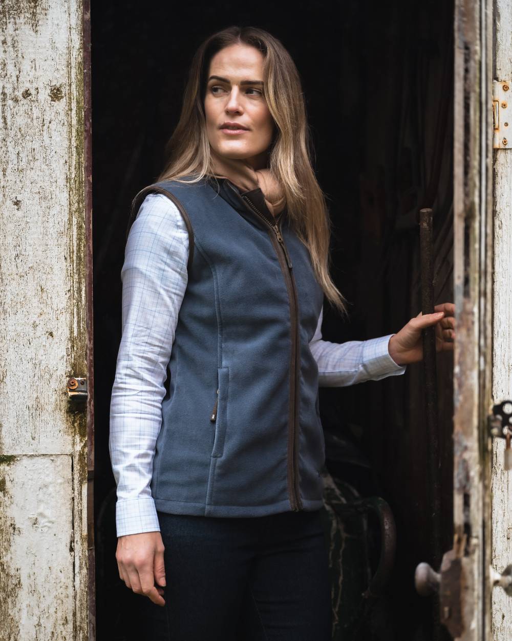Slate Grey coloured Hoggs of Fife Stenton Ladies Fleece Gilet with wooden background 