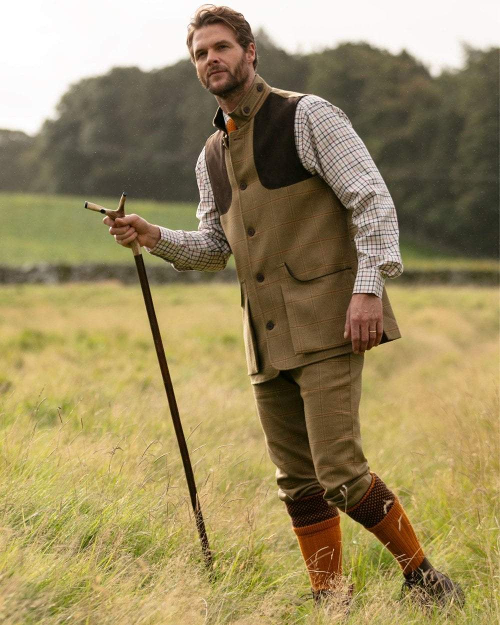Ochre coloured House of Cheviot Tayside Socks on field background