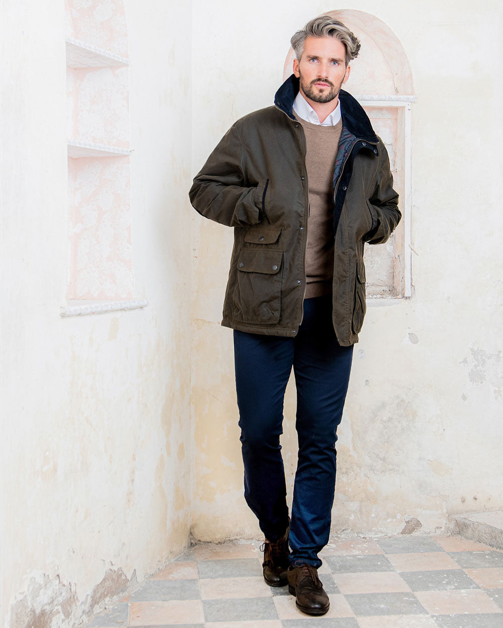 Olive coloured Jack Murphy Archie Wax Jacket on White wall background