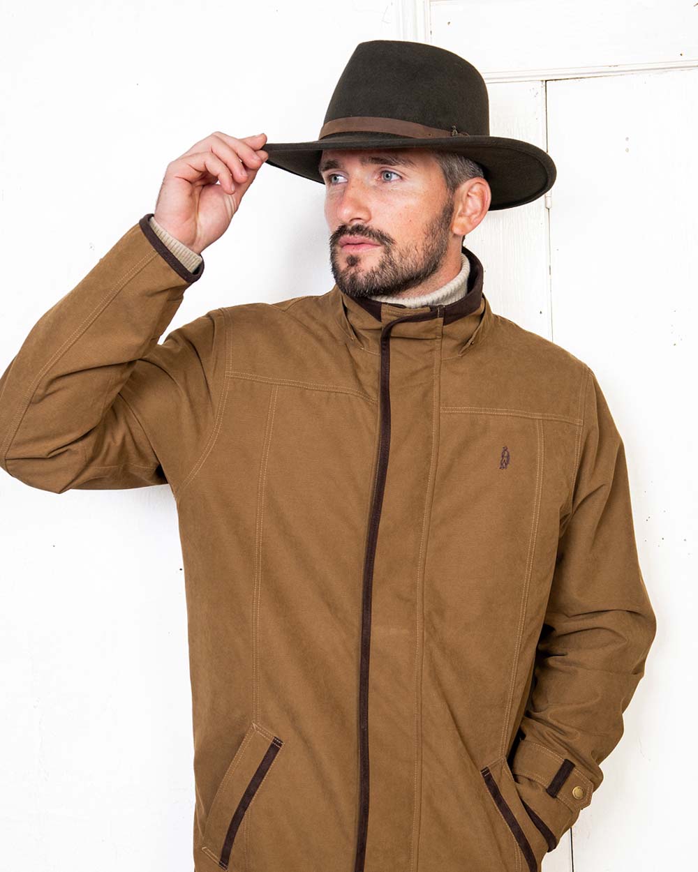 Brown coloured Jack Murphy Boston Crushable Felt Hat on wall background