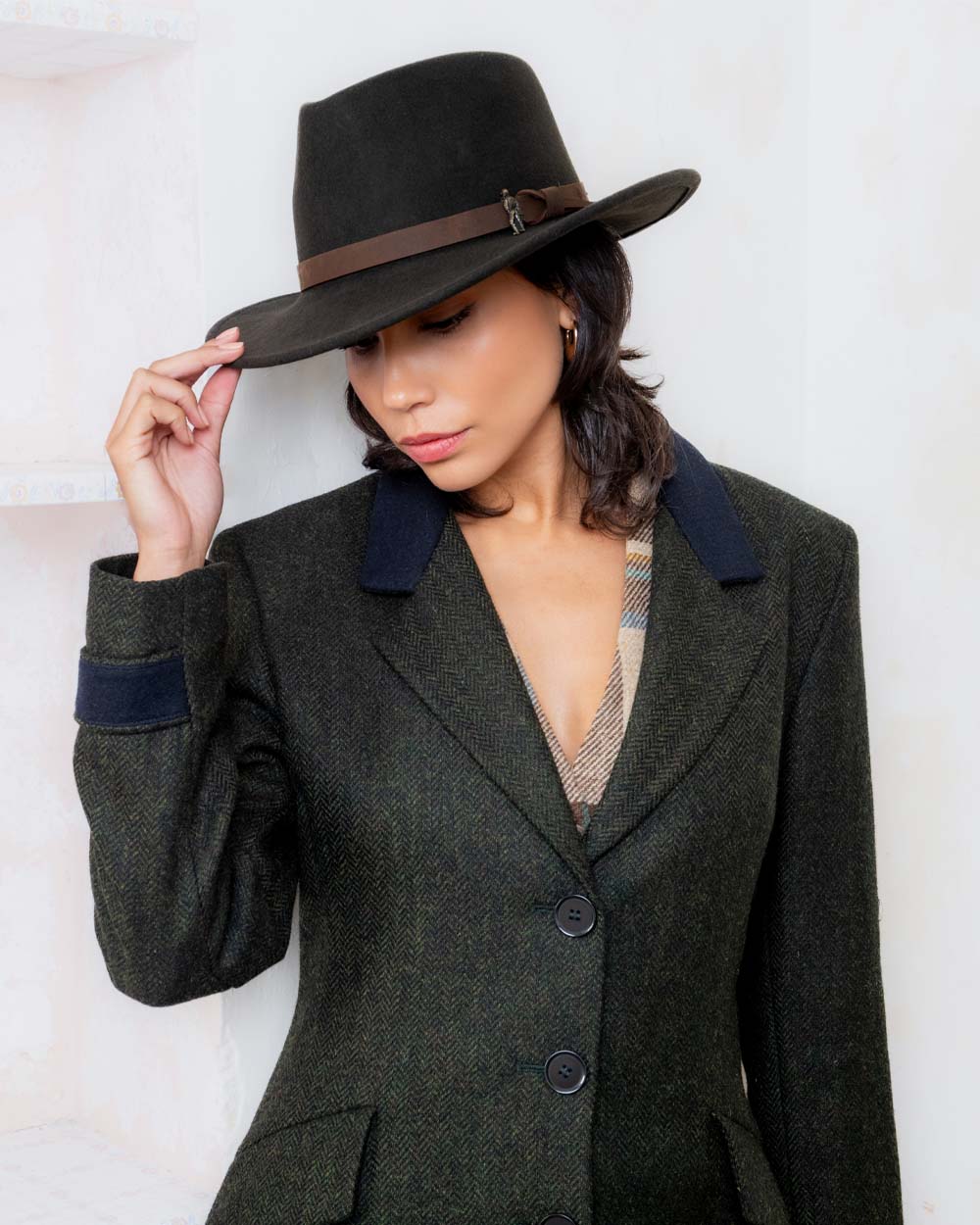 Olive coloured Jack Murphy Boston Crushable Felt Hat on wall background