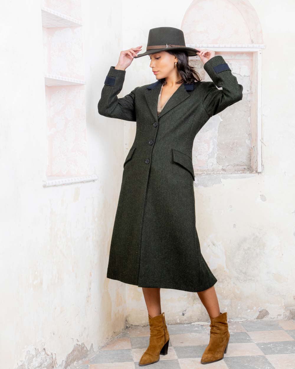 Olive coloured Jack Murphy Boston Crushable Felt Hat on wall background