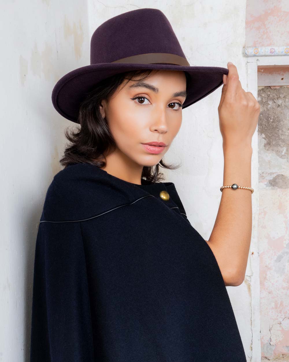 Plum coloured Jack Murphy Boston Crushable Felt Hat on wall background