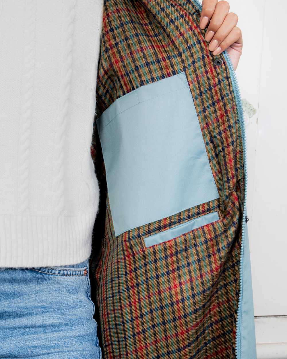 Smoke Blue coloured Jack Murphy Cotswold Ladies Waterproof 3/4 Coat on Teal background