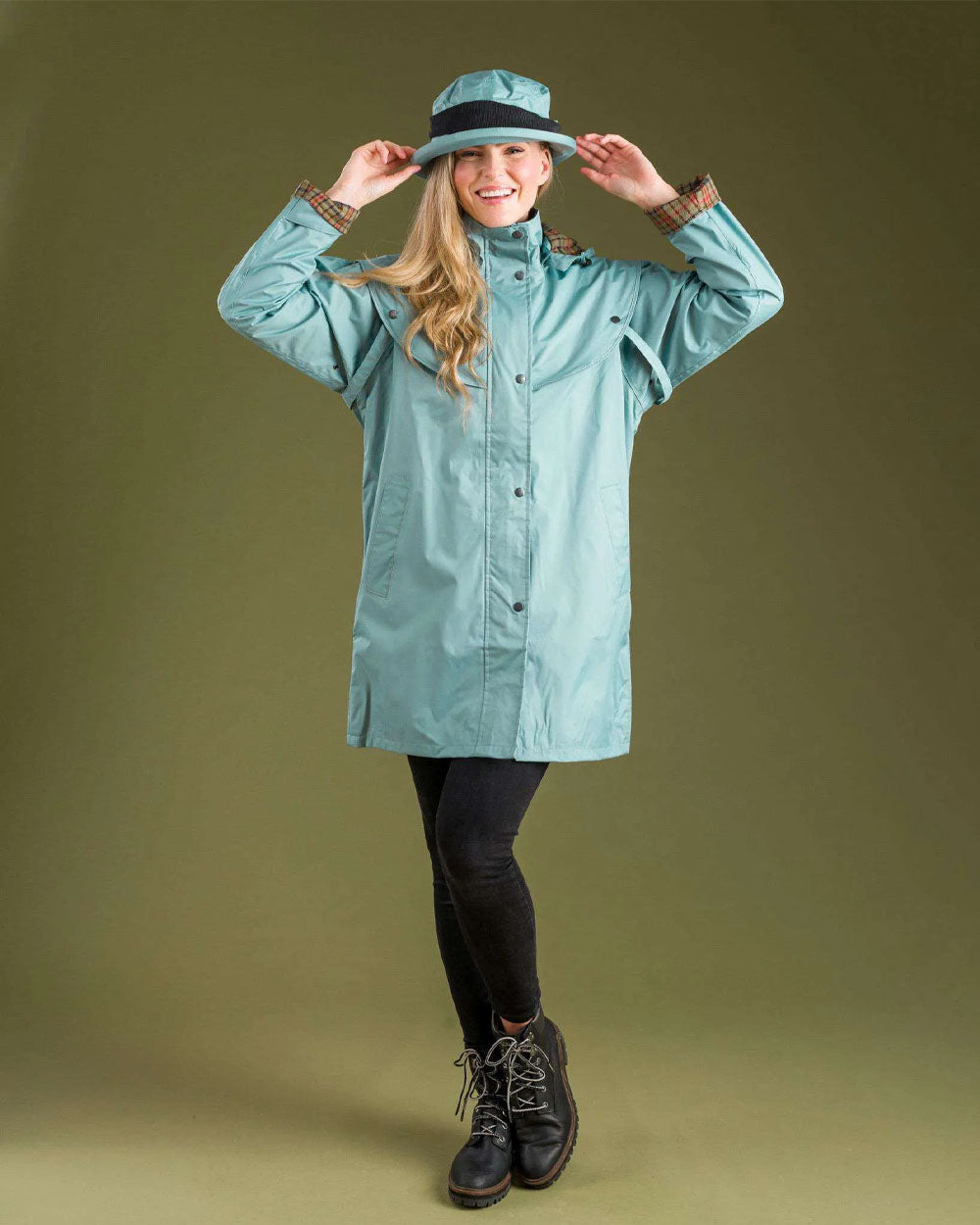 Smoke Blue coloured Jack Murphy Cotswold Ladies Waterproof 3/4 Coat on Green background