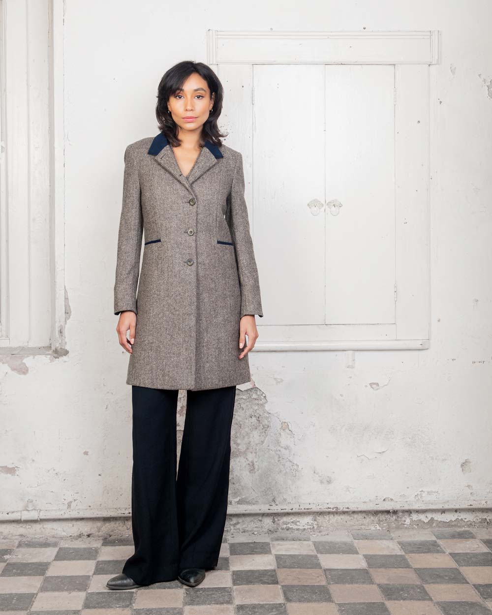 Light Tan Herringbone coloured Jack Murphy Isabella Tweed Coat on Urban background