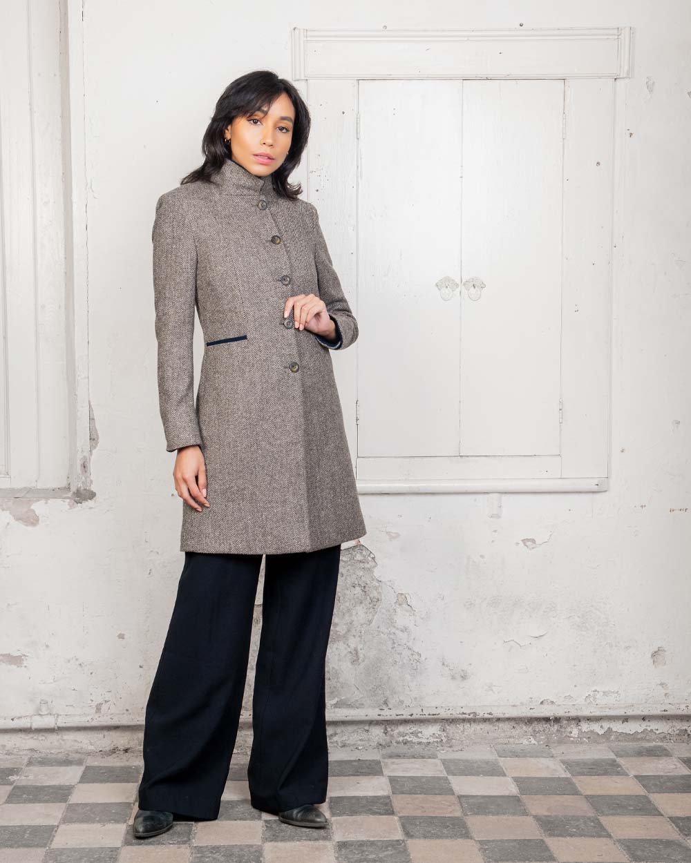 Light Tan Herringbone coloured Jack Murphy Isabella Tweed Coat on Urban background