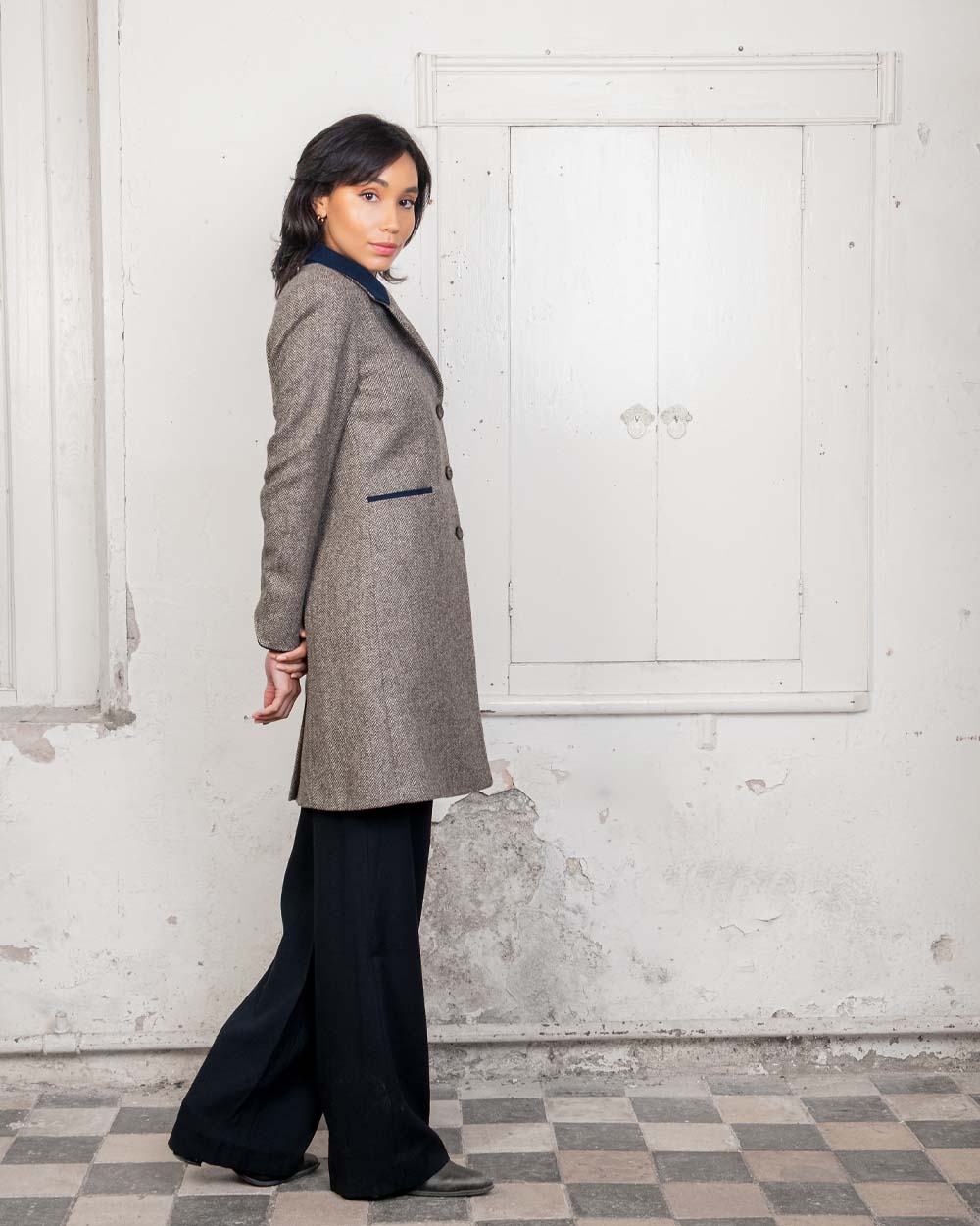 Light Tan Herringbone coloured Jack Murphy Isabella Tweed Coat on Urban background