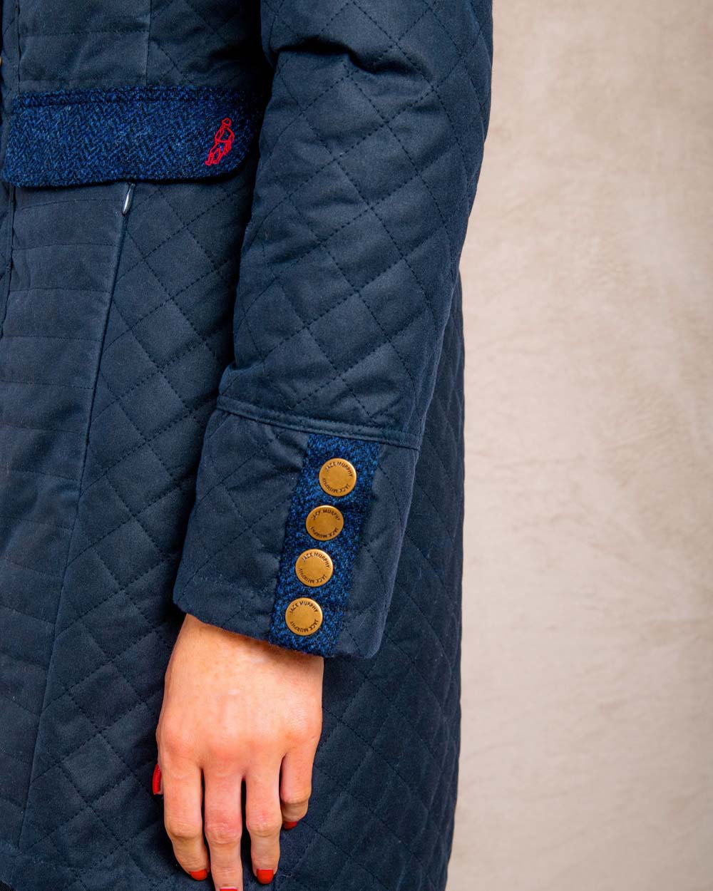 Navy coloured Jack Murphy Jodie Wax Coat on Pastel background