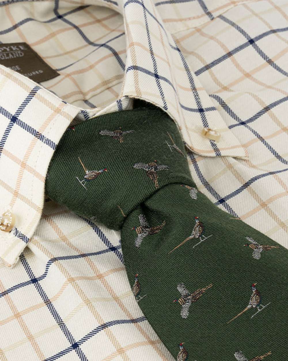 Green coloured Jack Pyke Silk Tie Pheasant on shirt background