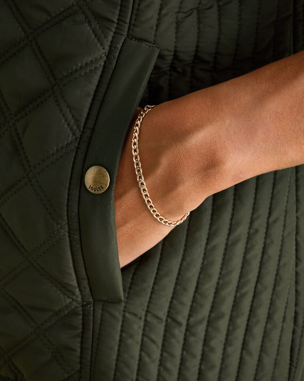 Khaki Coloured Joules Minx Showerproof Diamond Quilted Gilet On A White Background