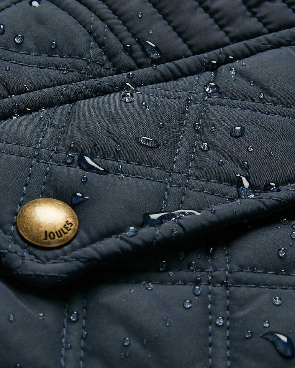 Navy Coloured Joules Minx Showerproof Diamond Quilted Gilet On A White Background