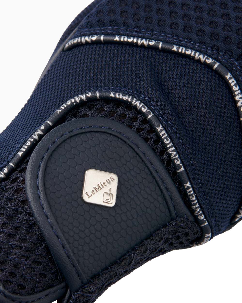 Navy coloured LeMieux 3D Mesh Riding Gloves on white background