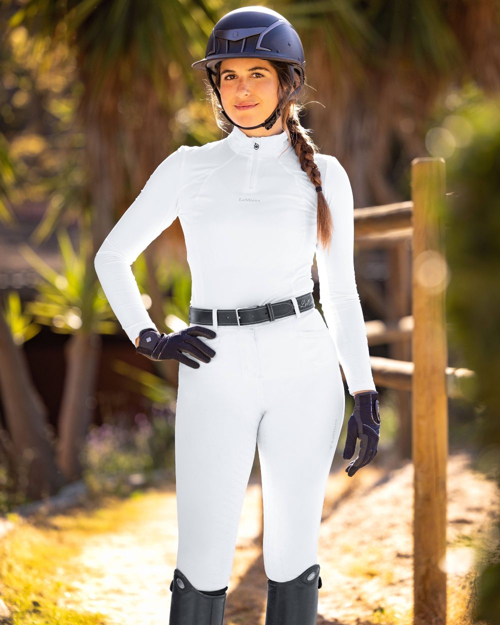 White coloured LeMieux Base Layer on green background