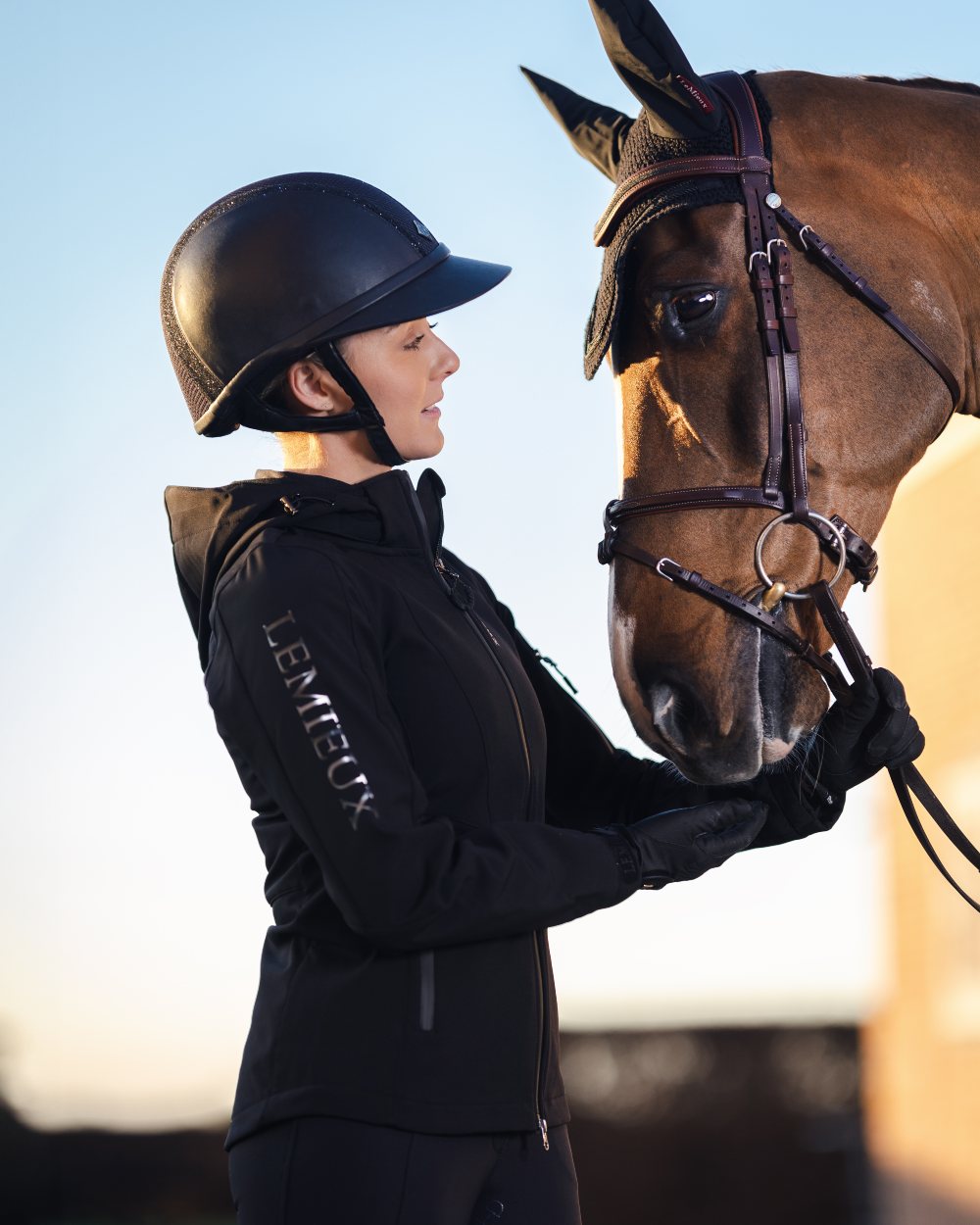 Black coloured LeMieux Celine Softshell Jacket on sky background