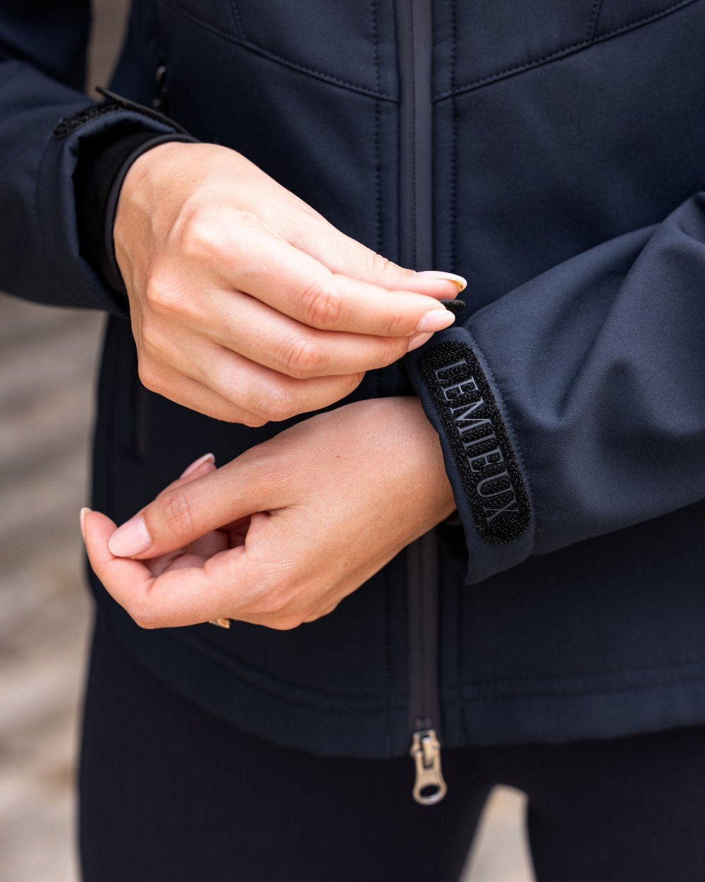 Navy coloured LeMieux Celine Softshell Jacket on grey background