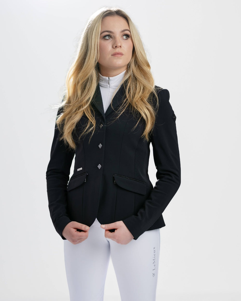 Black coloured LeMieux Dynamique Show Jacket on grey background