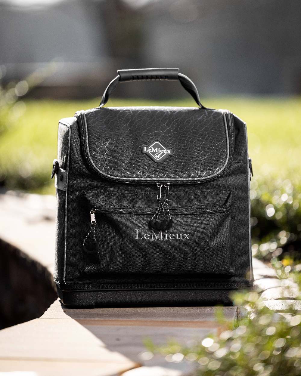 Black coloured LeMieux Elite Pro Grooming Bag on blurry background