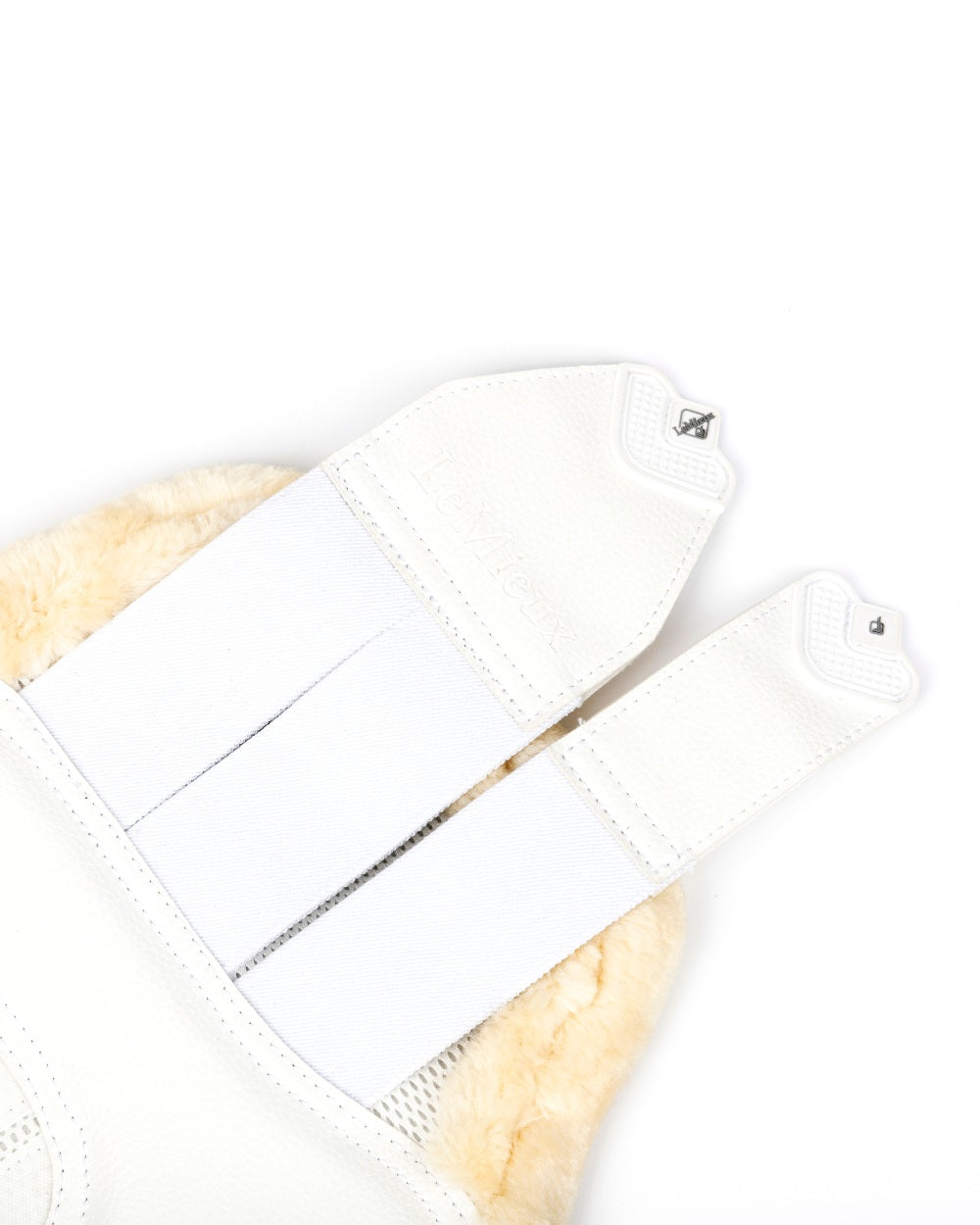 Natural/White coloured LeMieux Fleece Edged Mesh Brushing Boots on white background