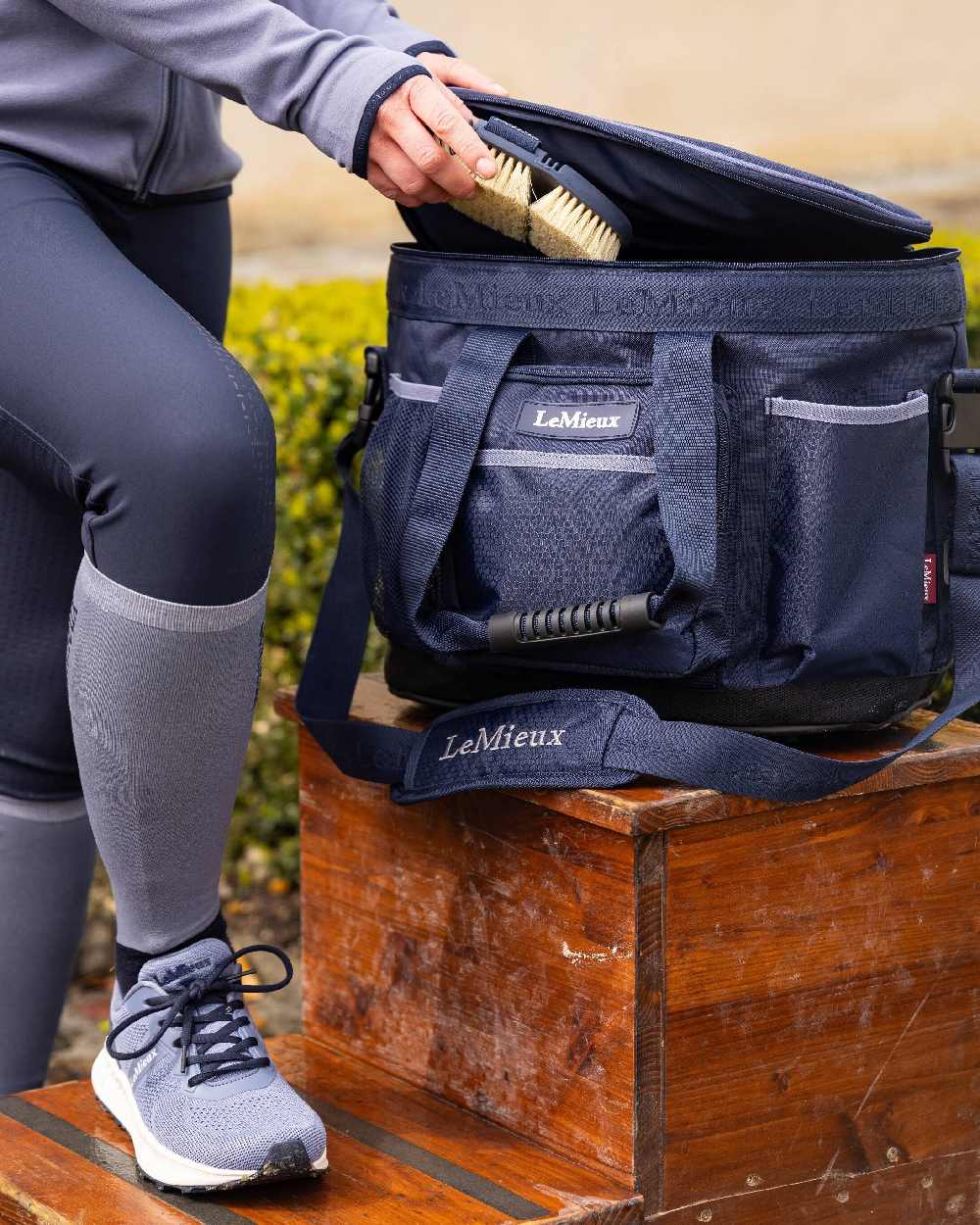 Navy coloured LeMieux Grooming Bag on blurry background