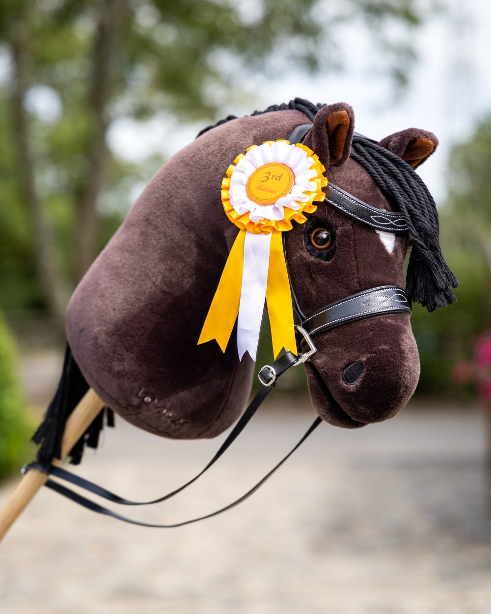 Freya Coloured LeMieux Hobby Horse On A Outer Yard Background