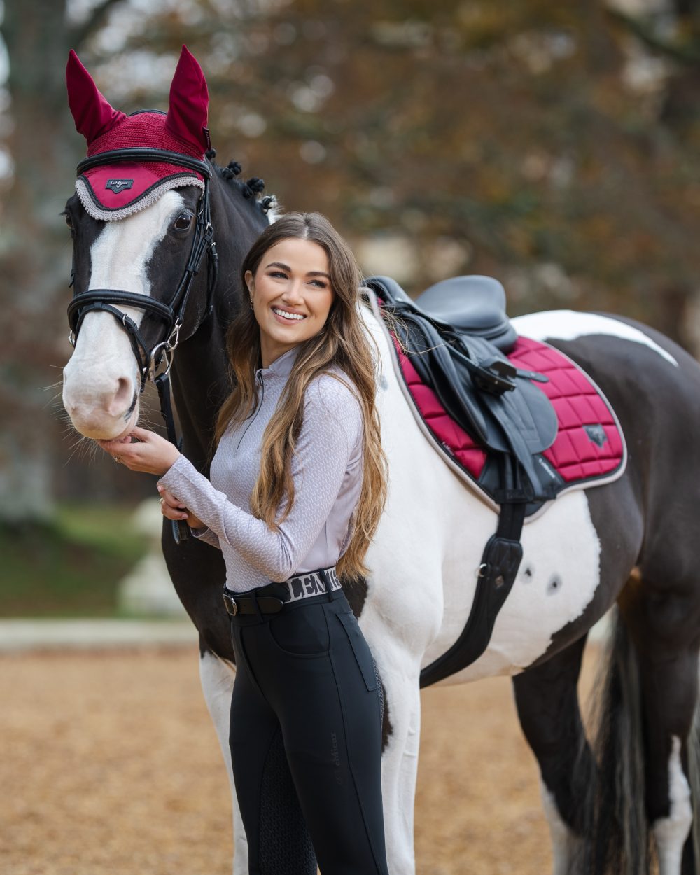 Ember Coloured LeMieux Loire Classic Close Contact Square On A Outer Yard Background